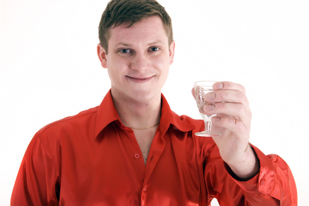 Young man toasting with a wineglass - Valokuva, kuva