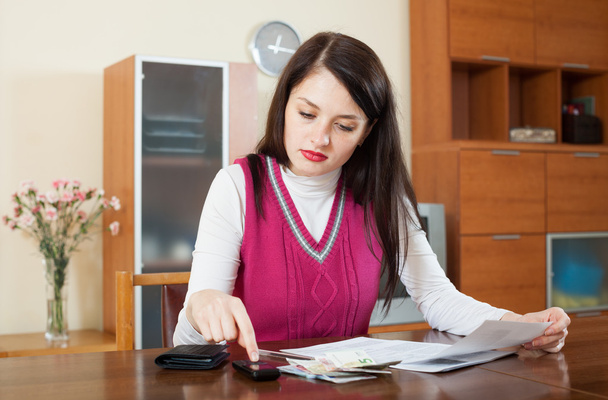 serious  woman calculating the family budget - Photo, Image