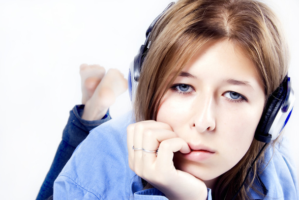 Young girl in headphones - 写真・画像