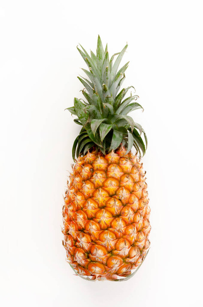 Fresh ripe pineapple fruit on white background - Foto, afbeelding
