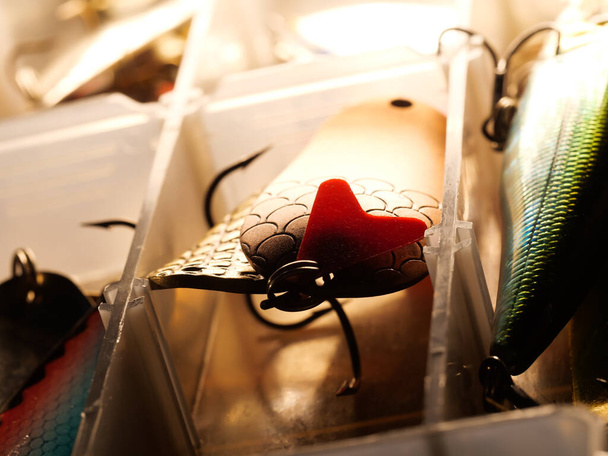 Fishing equipment on a old wooden table. Sport and recreation concept. Selective focus. Macro - Photo, Image