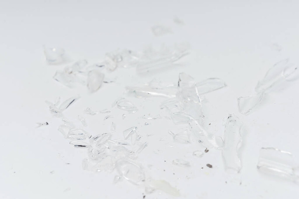 Glass from broken incandescent light bulbs on a white background. Crash light bulbs for spotlight close-up - Photo, Image