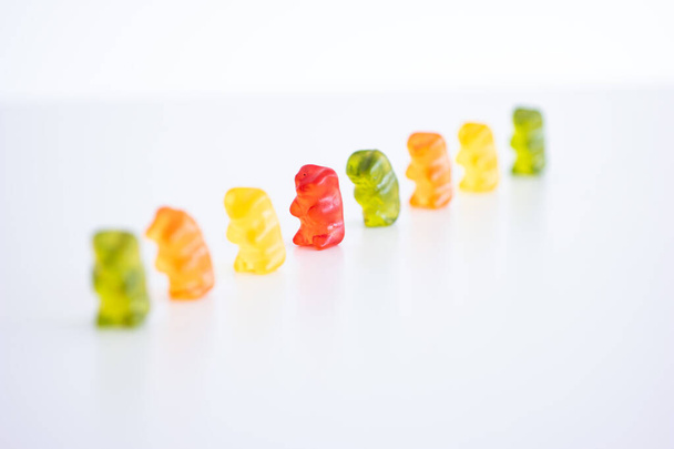 Group of mix colored gelatin candy gummy bears isolated on white background shallow depth of field. - Φωτογραφία, εικόνα