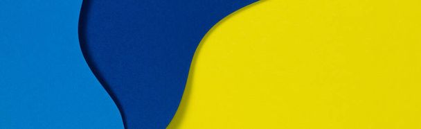 Abstract color papers geometry flat lay composition background with blue and yellow tones - Zdjęcie, obraz
