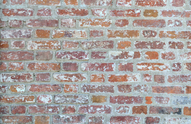 The wall is lined with very old brick, backgroun - Foto, Imagem