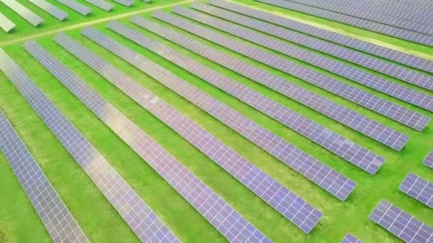 Ecology of solar power plant panels in the fields green energy on a sunny day - Footage, Video