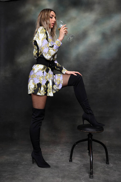 Beautiful, glamourous blonde girl posing in studio on isolated background. Style, trends, fashion concept. - Valokuva, kuva