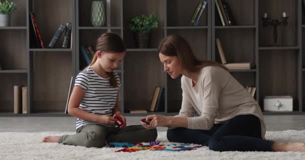 Loving mom play toy set with little daughter at home - Séquence, vidéo