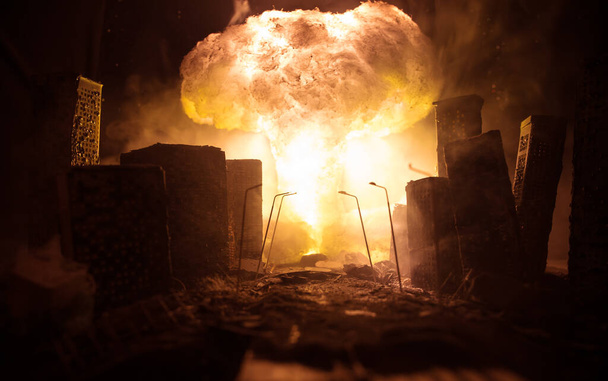 Nuclear war apocalypse concept. Explosion of nuclear bomb in city. City destroyed by atomic war. Creative artwork decoration in dark. Selective focus - Photo, Image