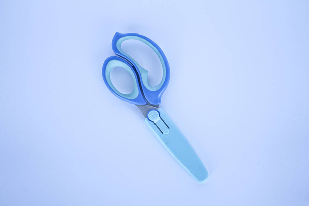 A pair of blue craft scissors for kids  - Fotó, kép
