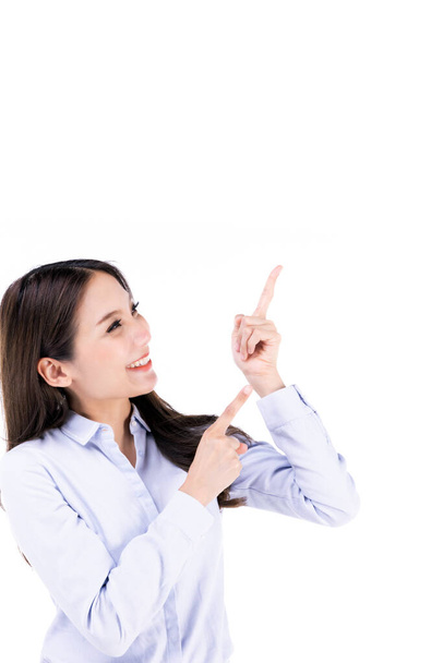 Asian young long hair successful beautiful female businesswoman hold  hands up use index finger point and look up smiling to sky in front on white background. - Foto, immagini