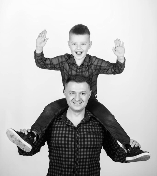 Feeling playful. take fife. take five to success. leisure time. fathers day. father and son in red shirt. happy family. little boy with dad man. childhood. parenting. Brave cowboy. take five concept - Фото, изображение