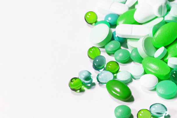 green pills on white background - Photo, Image