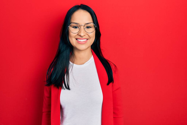 Beautiful hispanic woman with nose piercing wearing casual look and glasses with a happy and cool smile on face. lucky person.  - Photo, Image