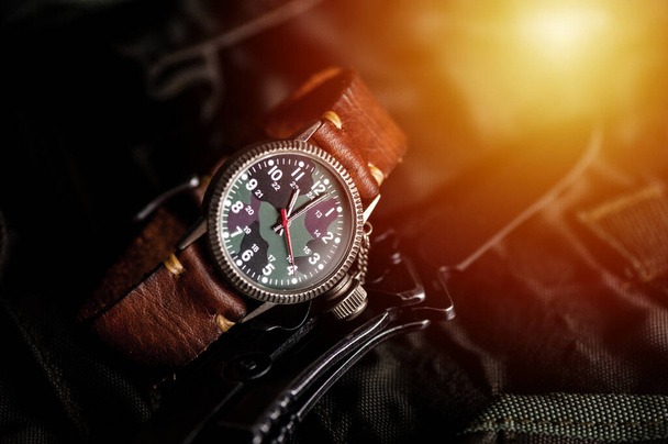 old military or field style of wristwatch with camouflage dial and leather band. - Photo, Image