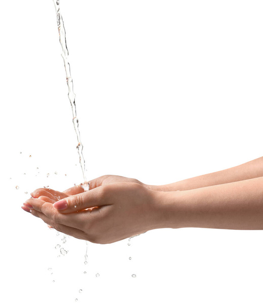 Pouring water into woman's hands on grey background, closeup - Valokuva, kuva