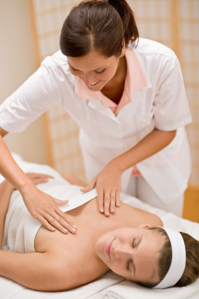 Skincare - woman cleavage massage at salon - 写真・画像