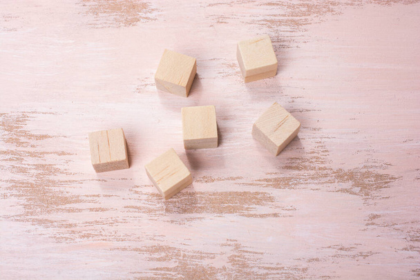 A top view shot of wooden blocks against a white background - Foto, Imagen