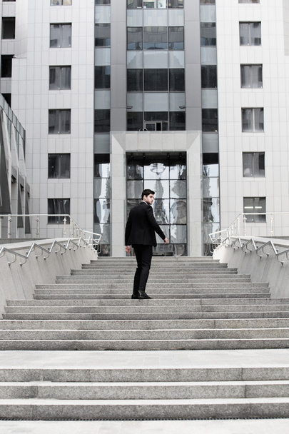 Businessman on stairs - Foto, afbeelding