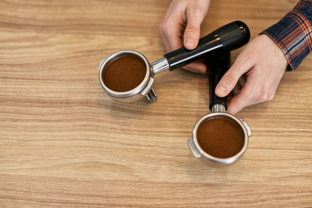 two holders for a coffee machine with freshly ground coffee - Φωτογραφία, εικόνα