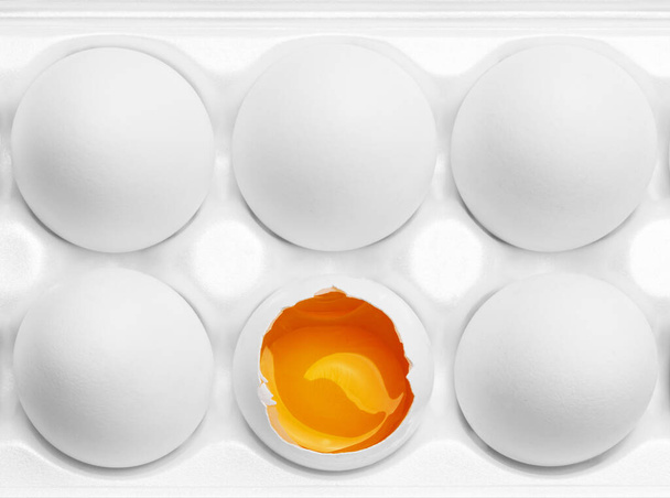Chicken eggs in the cassette box on a white background - Foto, Imagen
