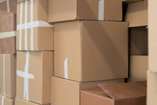 Stack of cardboard boxes ready to be shipped of a warehouse. Package storage room. - Photo, Image