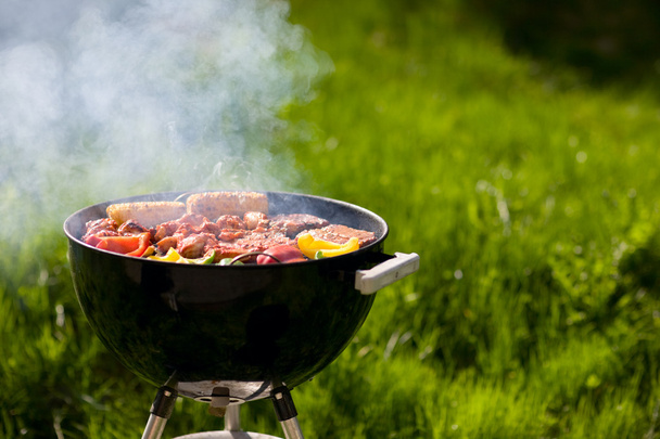 Grilling at summer weekend. Fresh meat and vegetables preparing on grill. - Fotoğraf, Görsel