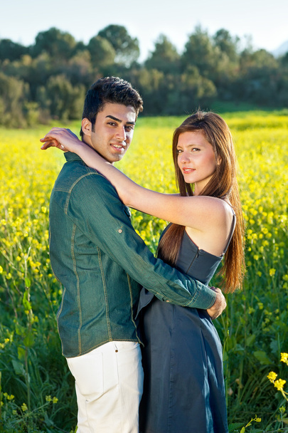 Woman with her arms around her boyfriend - Zdjęcie, obraz
