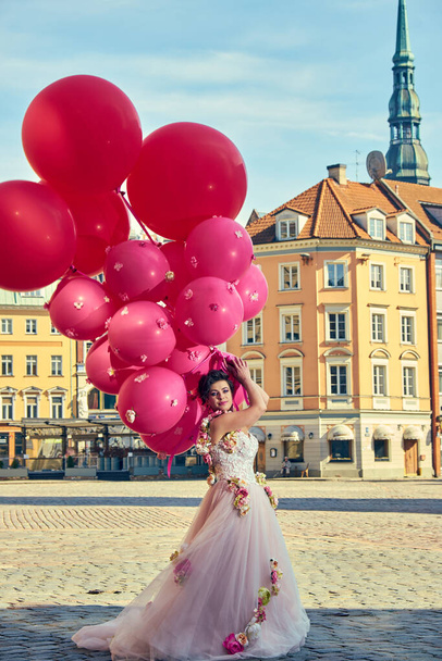 Beautiful Fashion woman in dress with balloons in city - Fotoğraf, Görsel