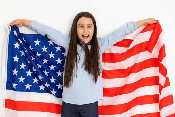 child holds a flag of America, USA. - 写真・画像