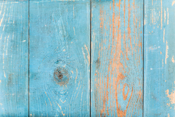 Blue wooden wall with cracked paint. Close up view - Фото, изображение
