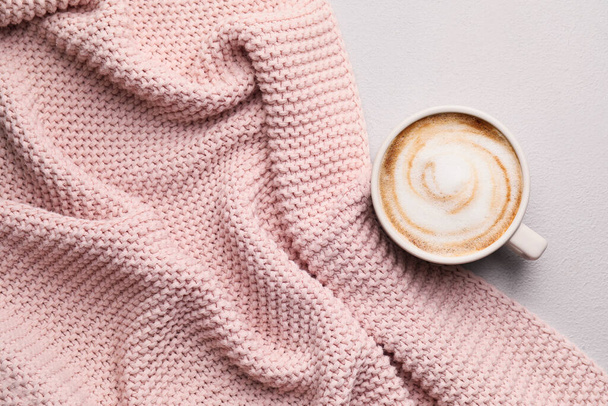 Cup of hot cappuccino on light background - Fotó, kép