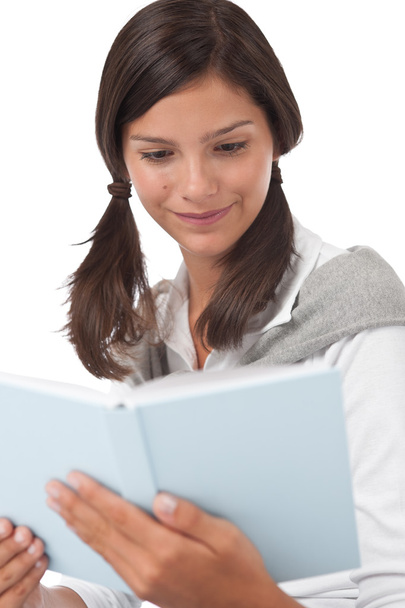 Portrait of teenager reading book - Φωτογραφία, εικόνα