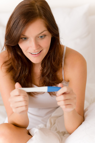 Pregnancy test - happy surprised woman, positive result - Fotografie, Obrázek
