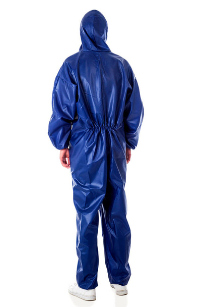 Man wearing blue protective suit isolated on white background - Photo, Image