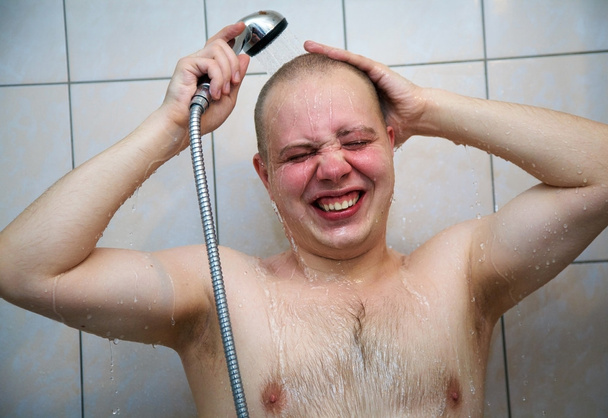 Man  in the shower - Фото, изображение