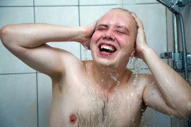 Man  washing in the shower - Фото, изображение
