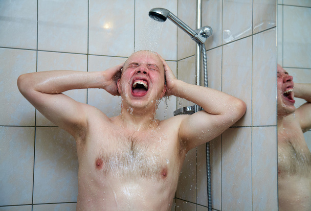 Man  washing in the shower - 写真・画像