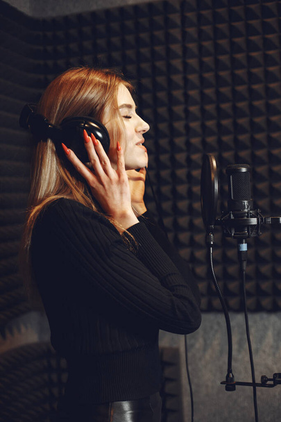 Singing and working in a studio with a microphone - Photo, image