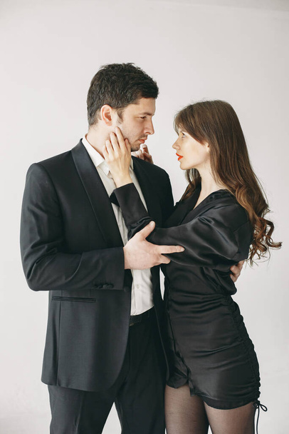 Portrait of young couple in love posing at studio - Photo, Image
