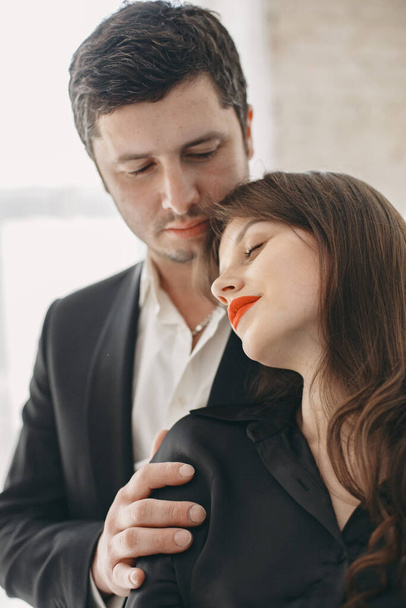 Portrait of young couple in love posing at studio - Foto, Imagen