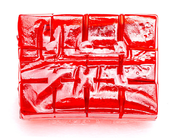 Block of cubes of red strawberry jelly on a white background - Fotó, kép
