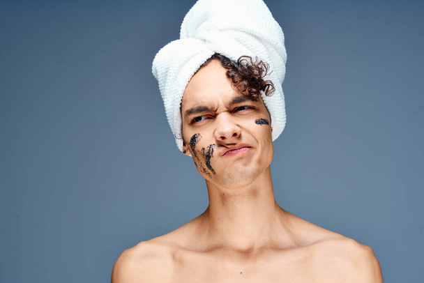 man with bare shoulders black cream face mask clear skin - Photo, Image