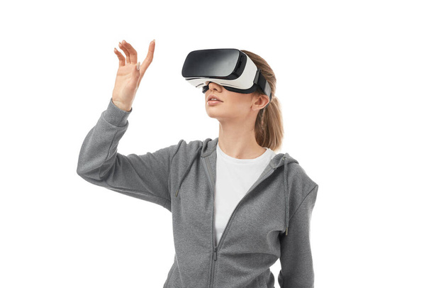 Woman in VR headset touching air - Foto, Bild