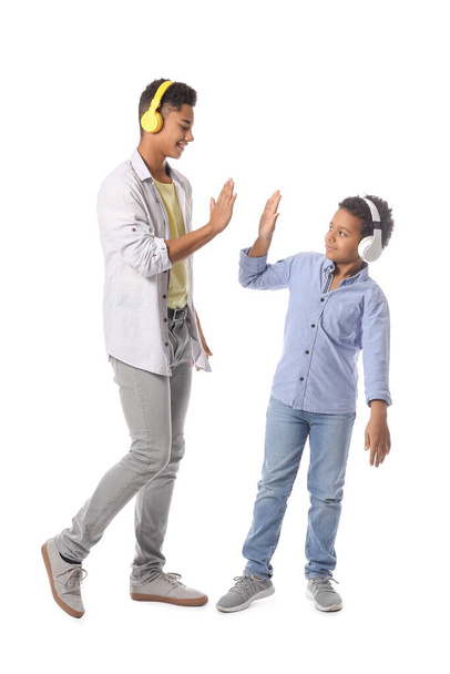 African-American boys giving each other high-five on white background - Photo, Image