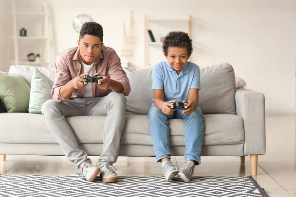 African-American boys playing video game at home - Photo, Image