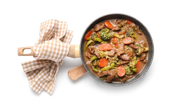 Tasty beef stroganoff with vegetables on white background - Photo, Image