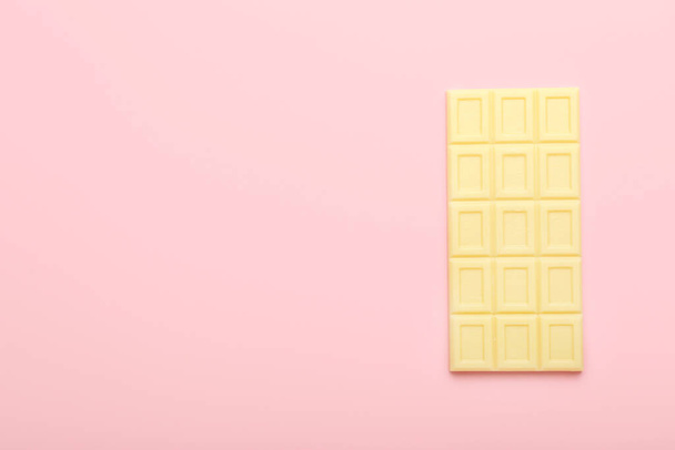 Tasty white chocolate on color background - 写真・画像