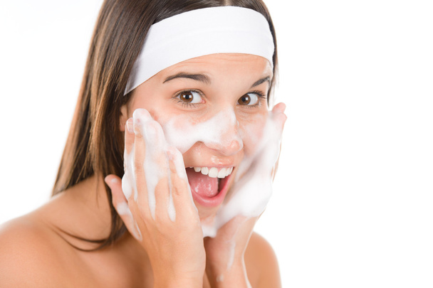 Teenager problem skin care - woman wash face - Foto, imagen
