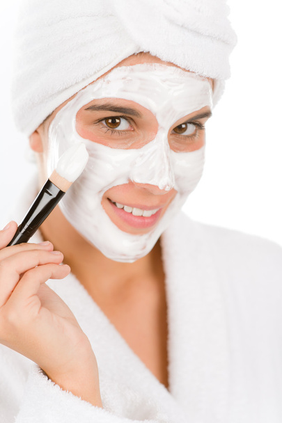 Teenager problem skin care - woman facial mask apply with brush - Fotó, kép